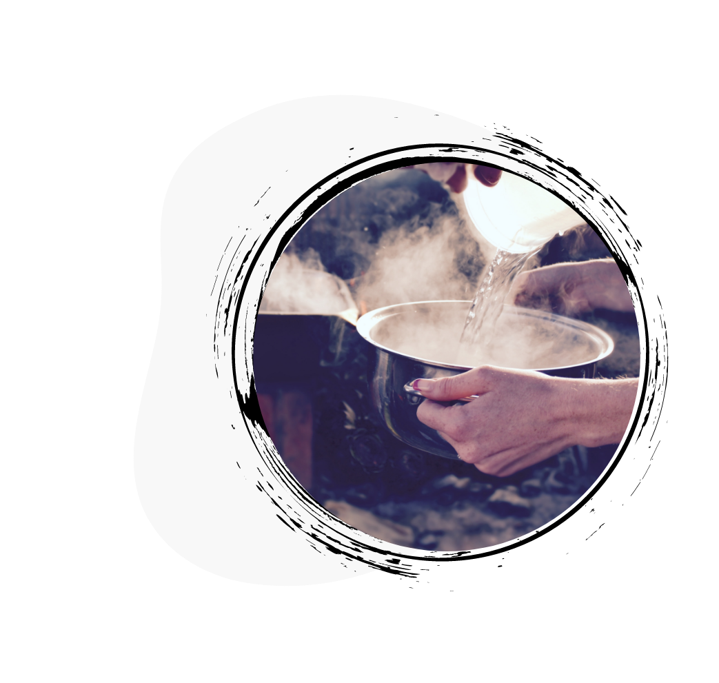 Hot water bring poured into a bowl Hot water bring poured into a bowl